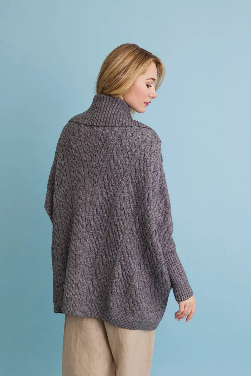 Chunky cable-knit poncho cardigan in gray, back view with cable knit pattern
