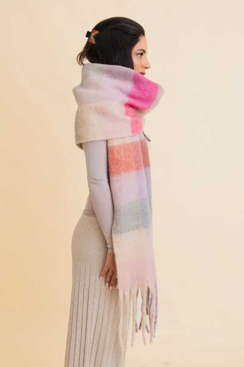 Oversized plaid scarf in pastel pink, lavender, and cream with long fringe