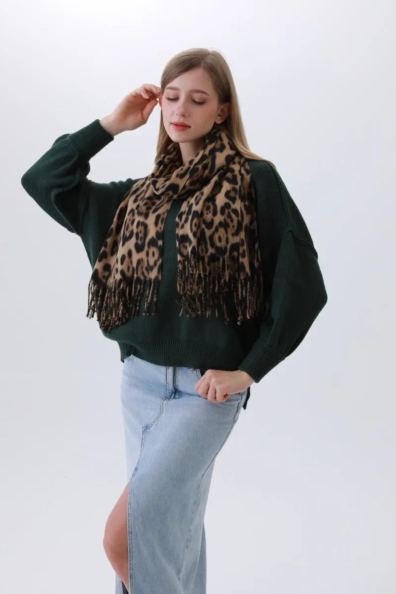 Leopard-print scarf draped with black fringes