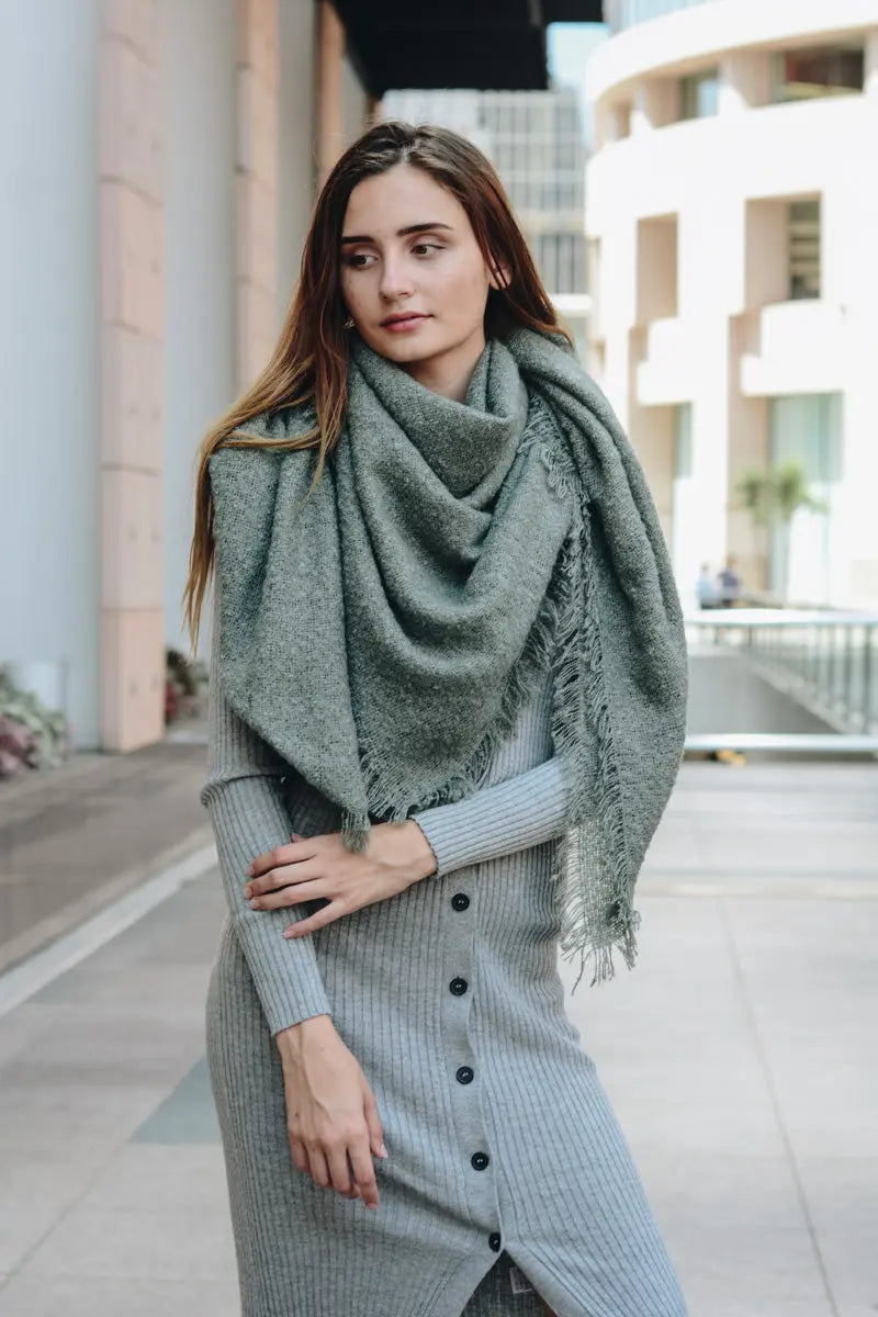 Sage green plush mohair square scarf with draped cowl and frayed fringe ends.