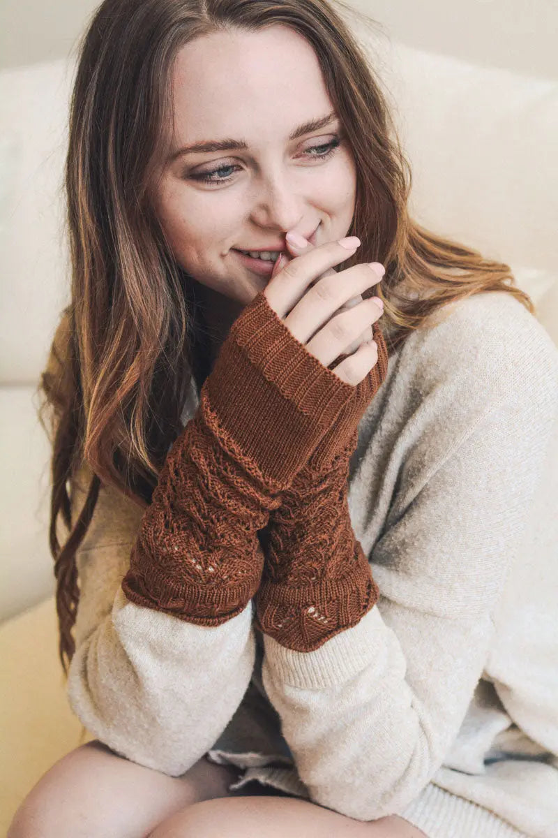 Rust brown knit texting-friendly arm warmers with textured open-knit cuffs