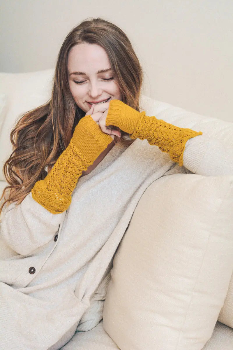 Mustard knit texting-friendly arm warmers with open-knit cuff detail
