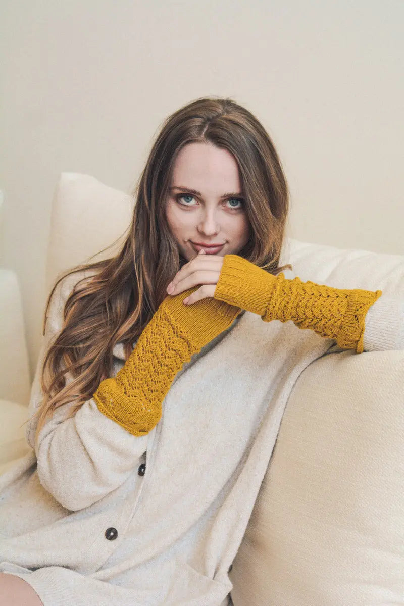Mustard knit texting-friendly arm warmers with open-knit cuff detail