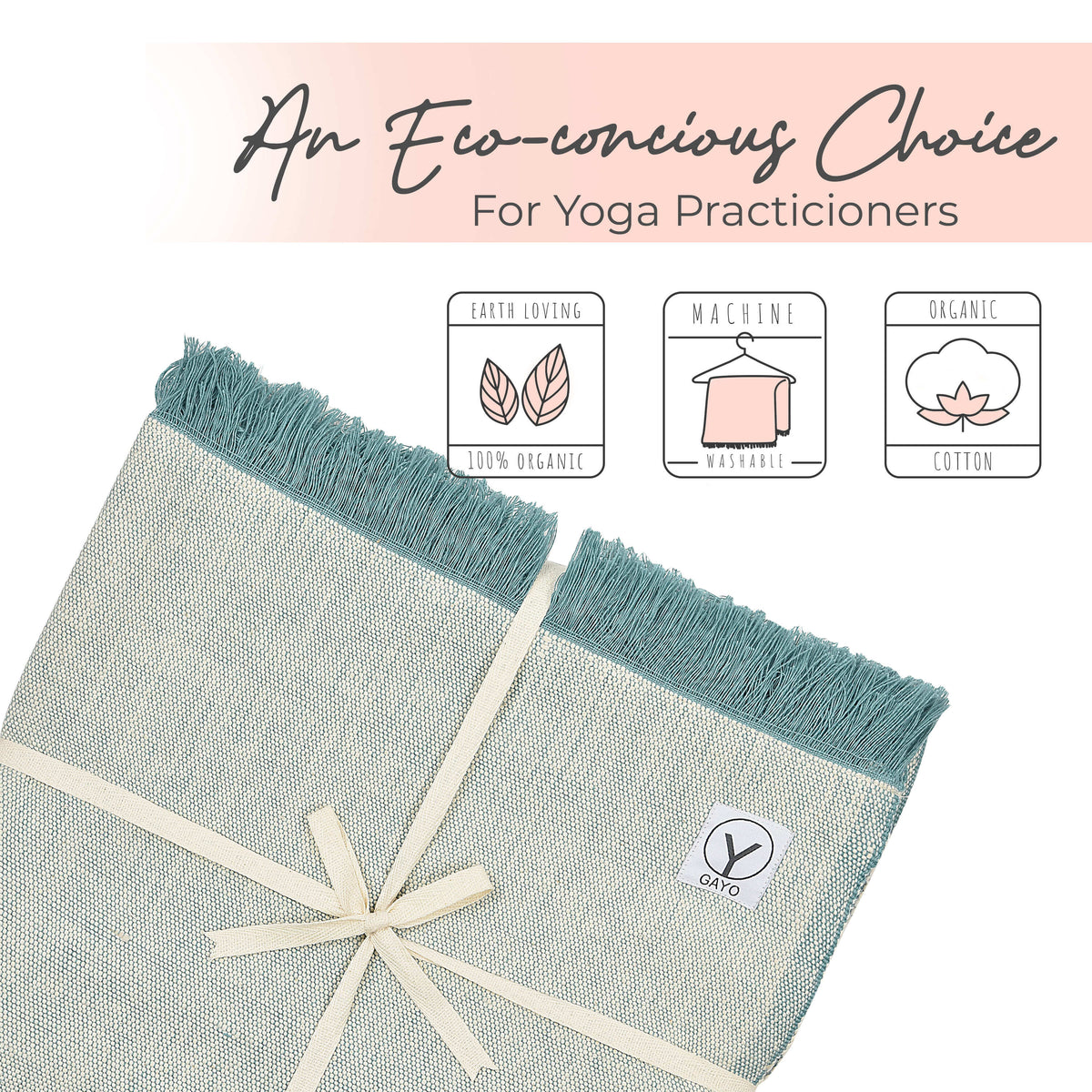 Light yoga blanket with teal tassel fringe and woven logo patch at corner.