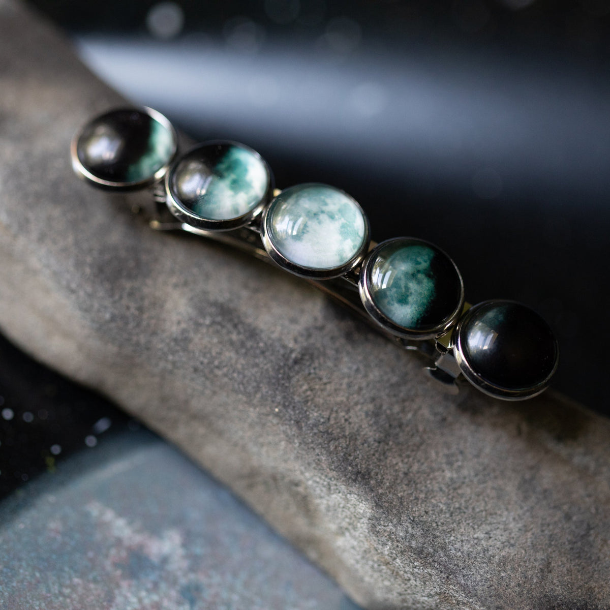 Silver hair clip barrette with teal oval cabochons and black end caps