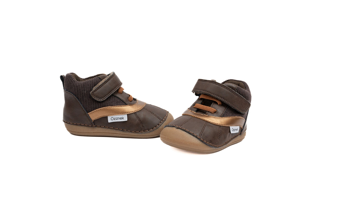 Kids barefoot boots, two-shoe angle view, dark brown uppers with tan strap details