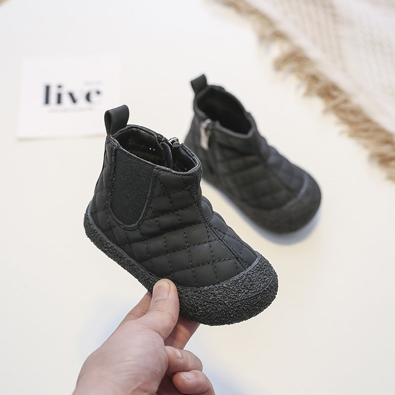 Soft-soled cotton child boots in black, side view with quilted upper and textured sole