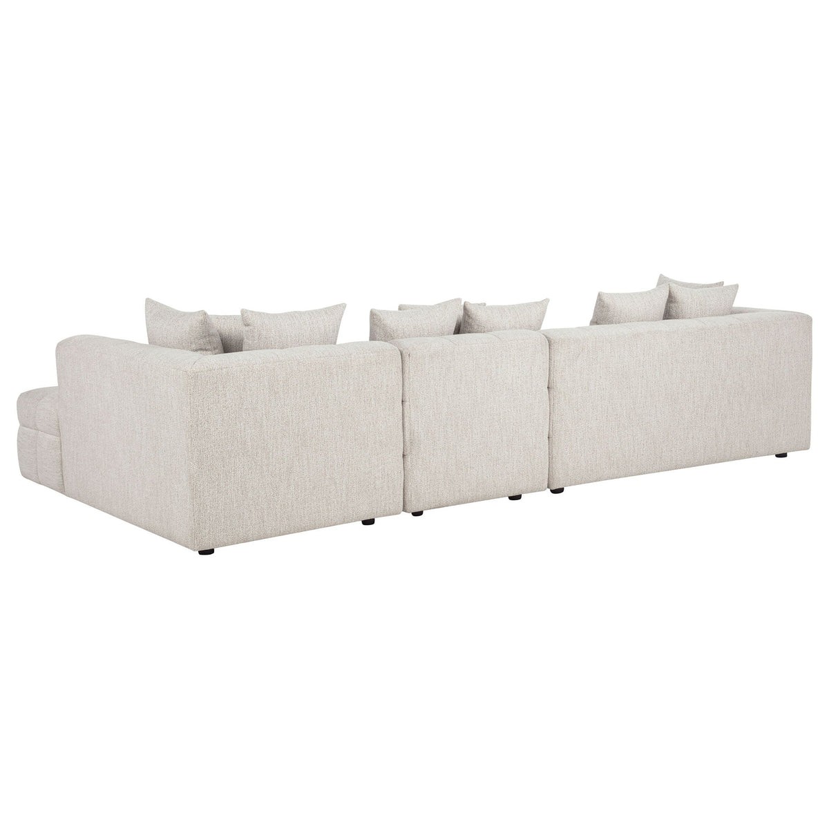 Light beige sectional sofa with chaise and multiple back cushions, boxy armrests