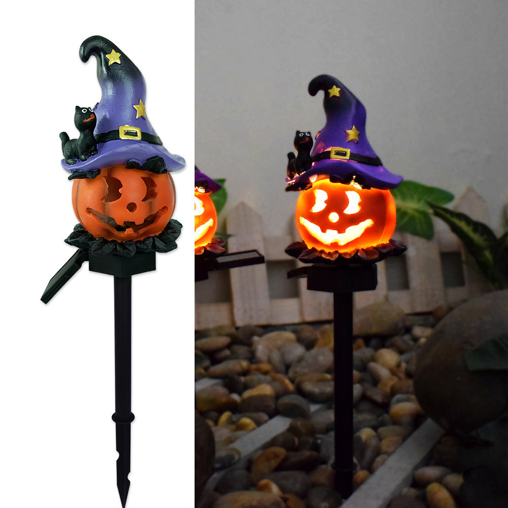 Solar Halloween pumpkin lantern stake lights with purple witch hat and glowing jack-o’-lantern face