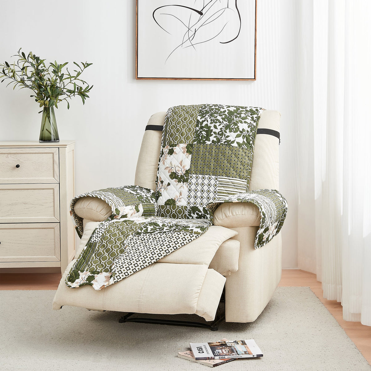 Reversible armchair protector set with green and cream patchwork quilted cover
