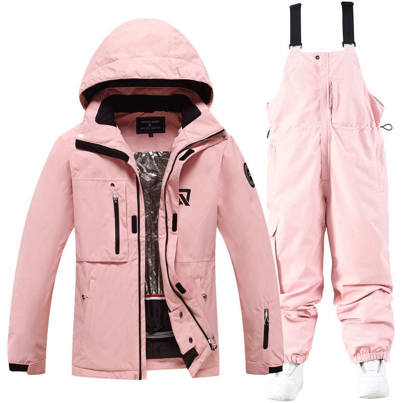 Pink hooded ski jacket and matching pink snow pants set with black trim and pockets
