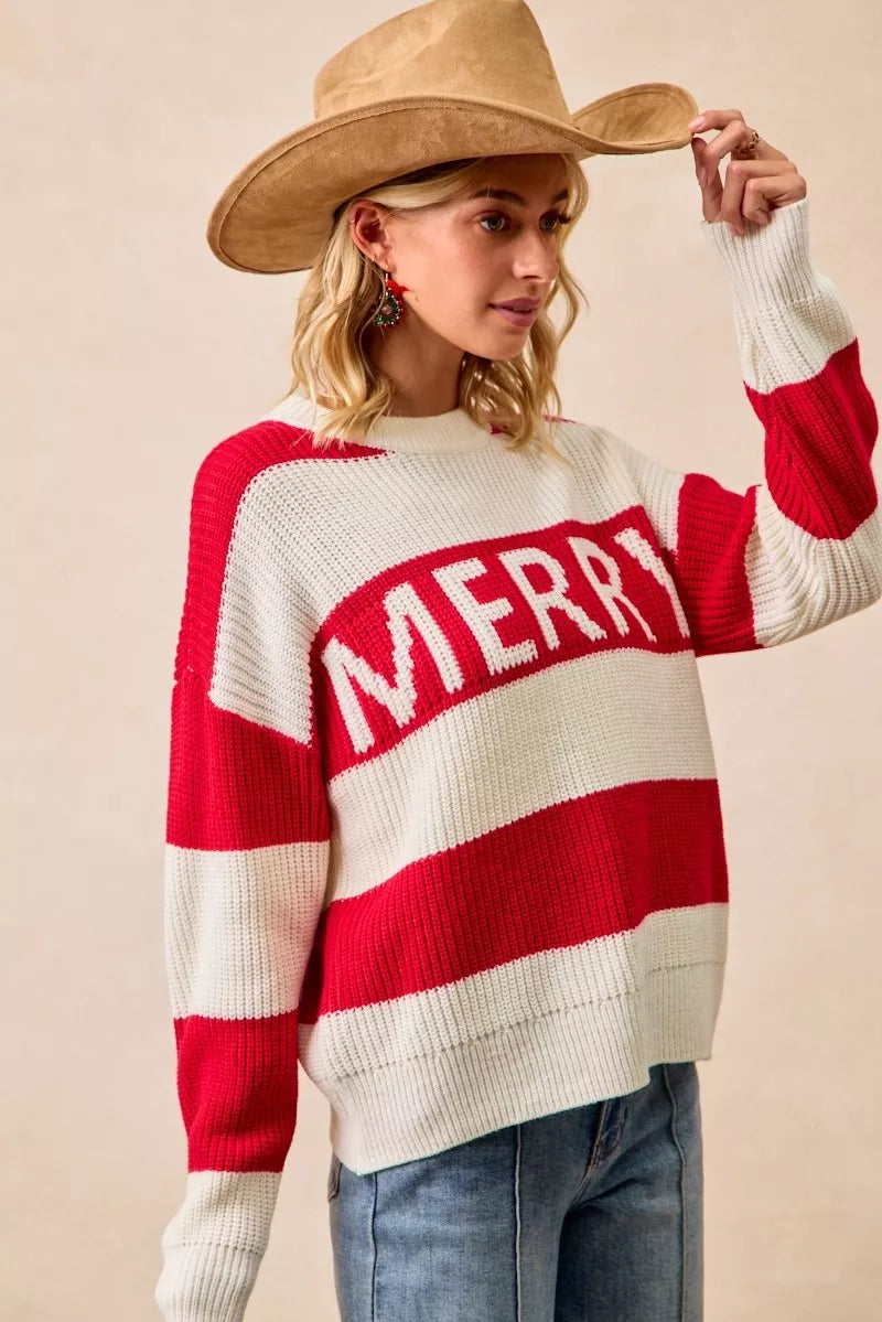 Ivory and red striped knit sweater with “MERRY” lettering and long sleeves