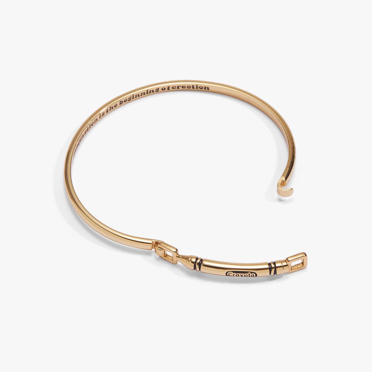 Gold Crayola crayon tension bangle with engraved slogan and square clasp