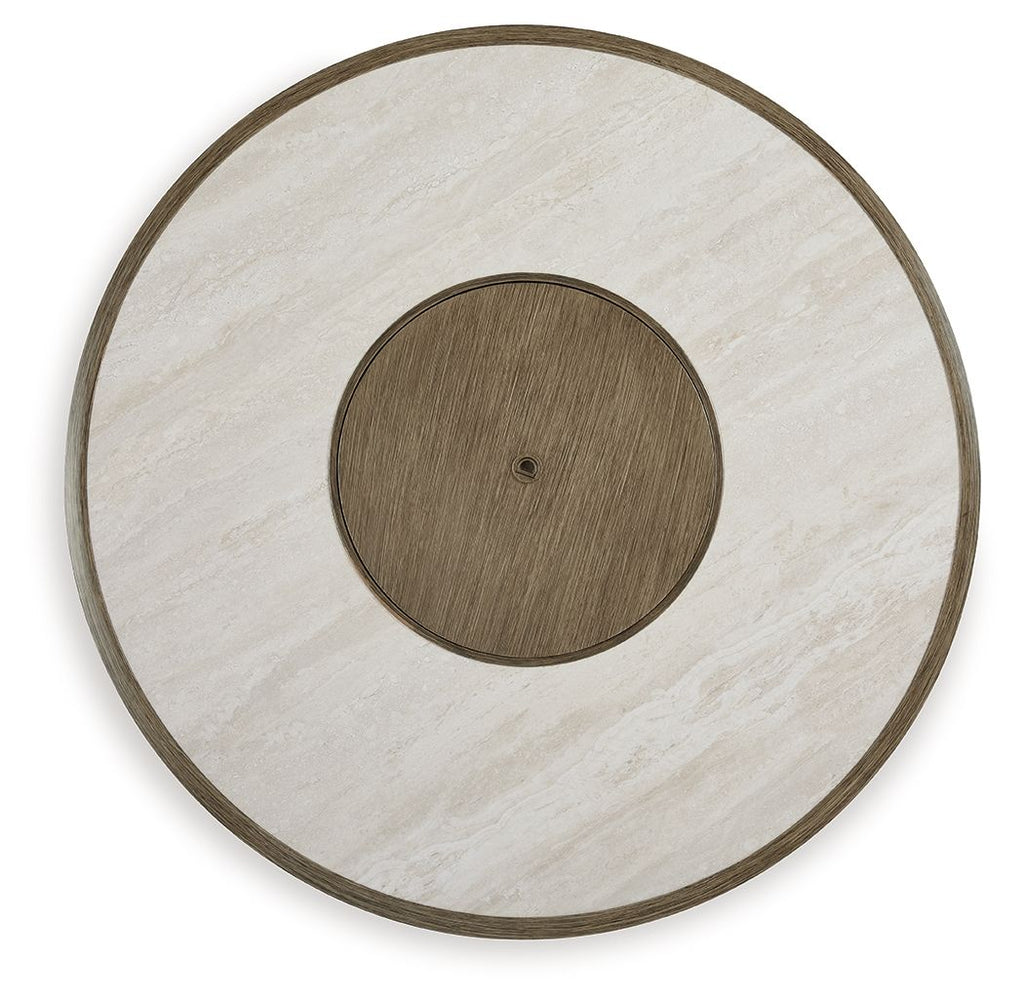 Round fire pit table with beige tabletop, dark outer rim, and centered burner cover