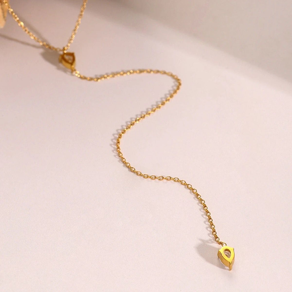 Gold-tone necklace with teardrop crystal drop and smooth link chain