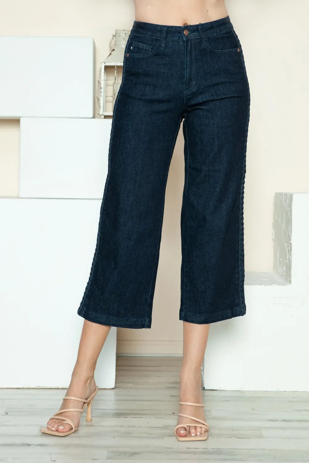 Dark blue denim crop wide-leg jeans for women, mid-rise with side braid detail.
