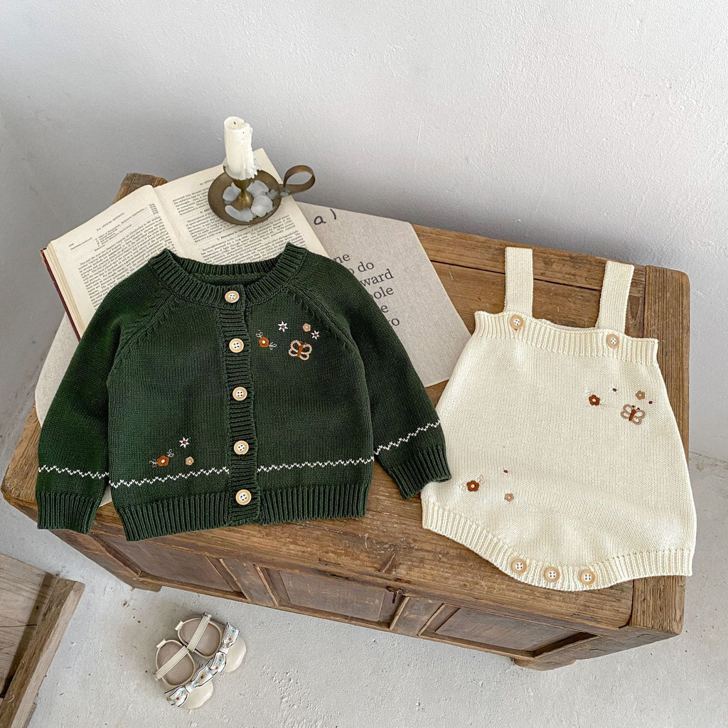 Infant dark green knit cardigan with contrast trim, button front, and small embroidered motifs