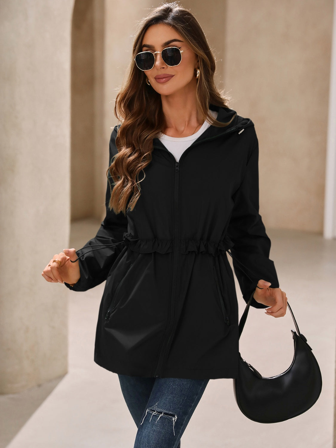 Black hooded windbreaker jacket with zip front and gathered skirt hem