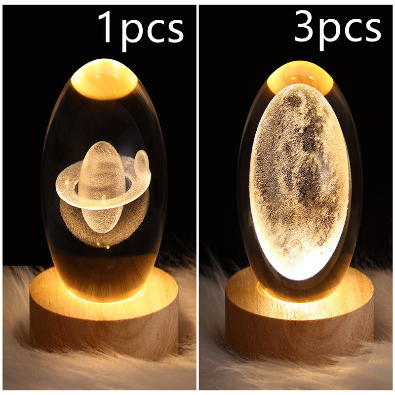 LED galaxy crystal ball lamp with textured planet surface and glowing base; wooden base