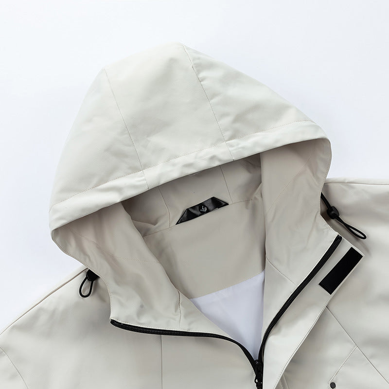 Light khaki hooded jacket interior view with taped seams and snap pocket detail