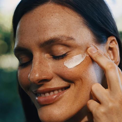 Plumping night cream applied to face under-eye area