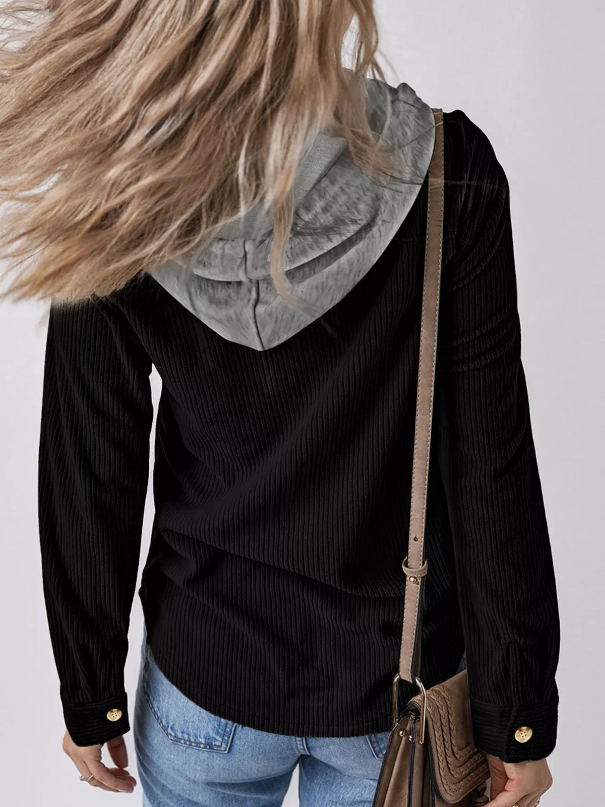 Black corduroy hooded button-down jacket, front close-up with gold buttons