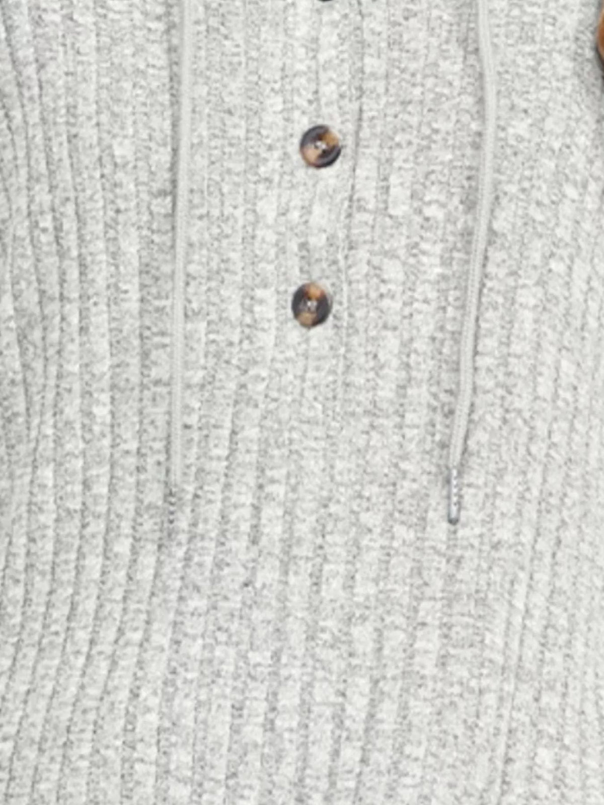 Light gray ribbed knit hoodie close-up of button front and textured knit pattern