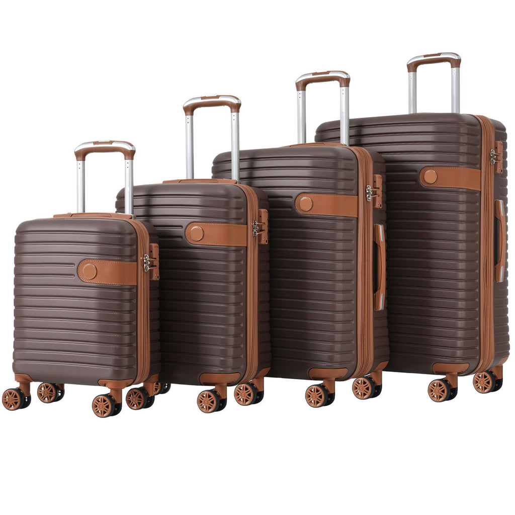 Set of four hard-shell suitcases in brown with telescoping handles and spinner wheels