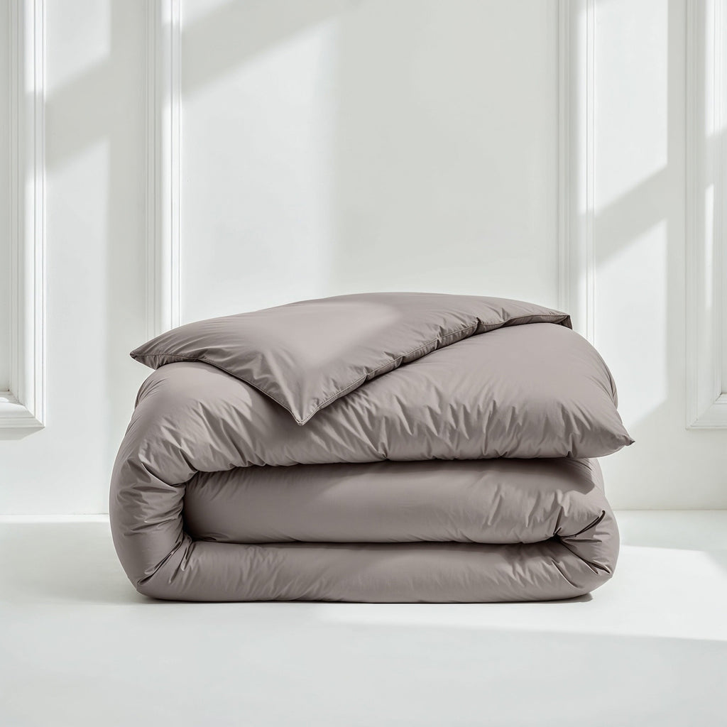 Charcoal gray sateen bedding bundle with folded duvet and pillow shams