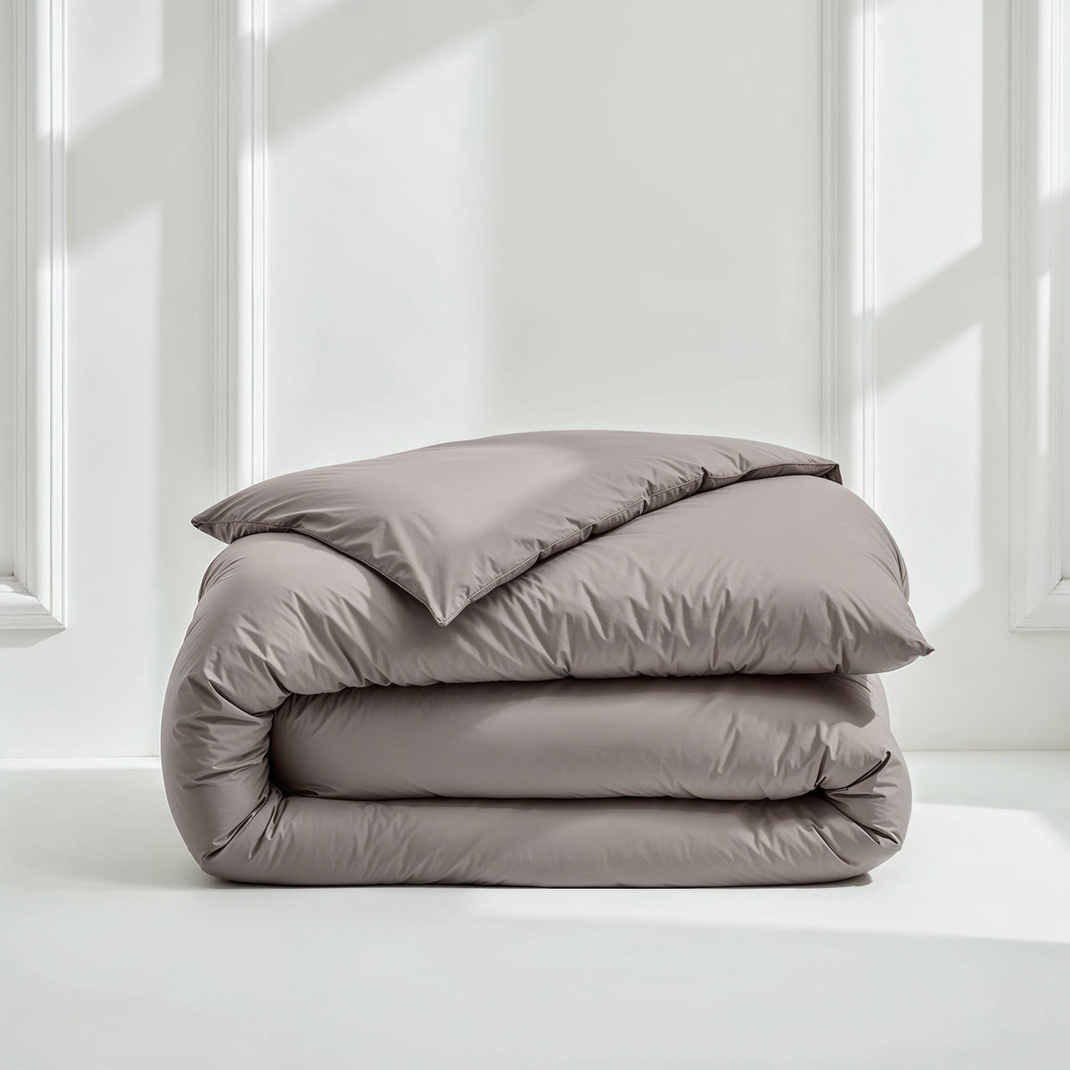 Charcoal gray sateen bedding bundle with folded duvet and pillow shams