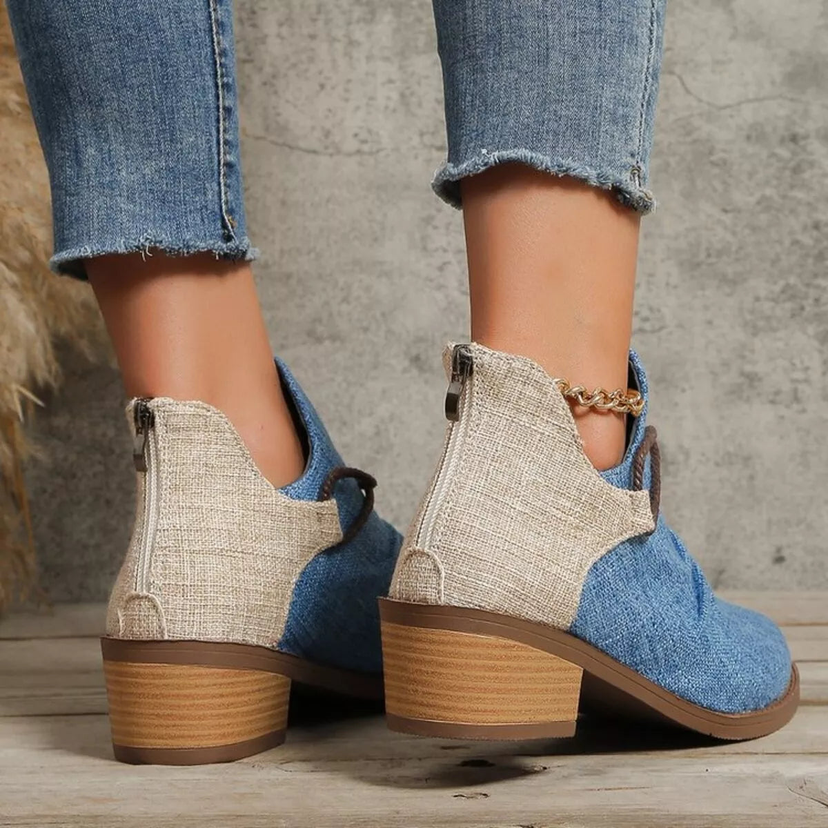 Dusty blue ankle boots with beige back panel and block heel, lace-up sides