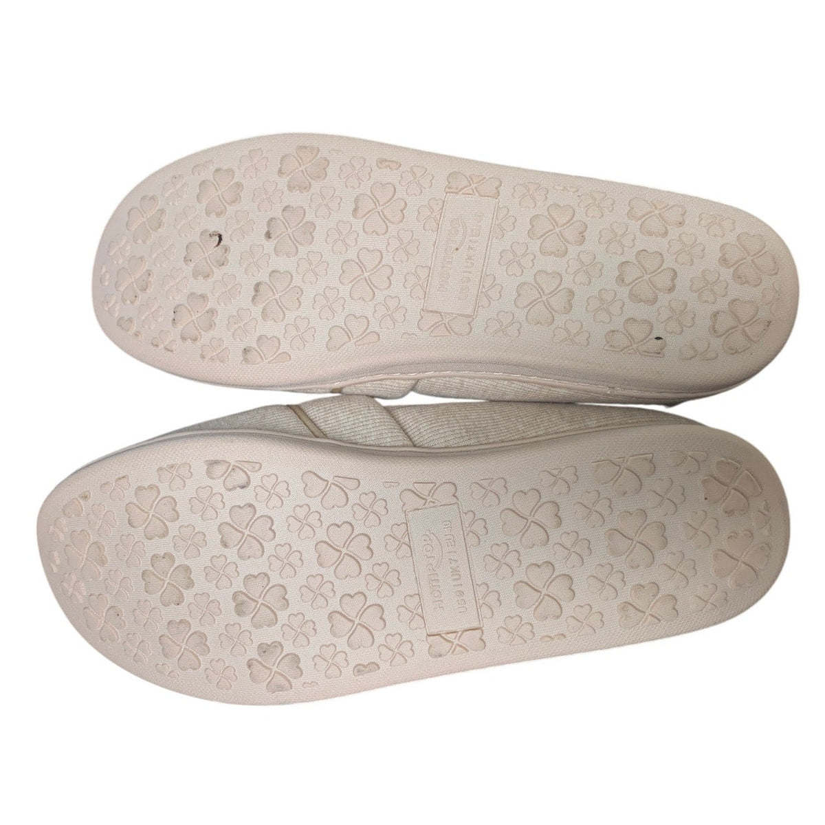 Tan slip-on loafer slippers with clover-pattern textured outsole