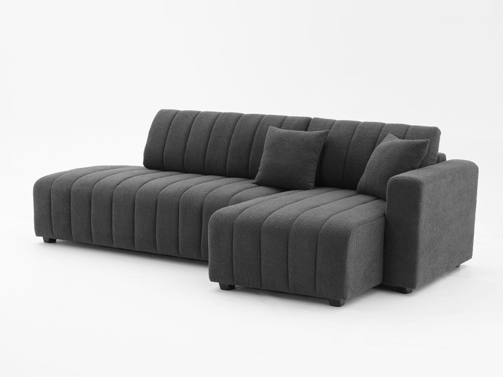Dark gray sectional sofa with chaise, wide seat with rolled corner and back cushions