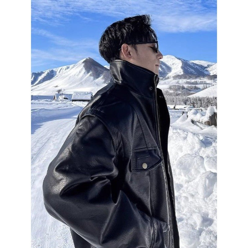 Men's black leather jacket, side profile with stand collar and snap chest pockets