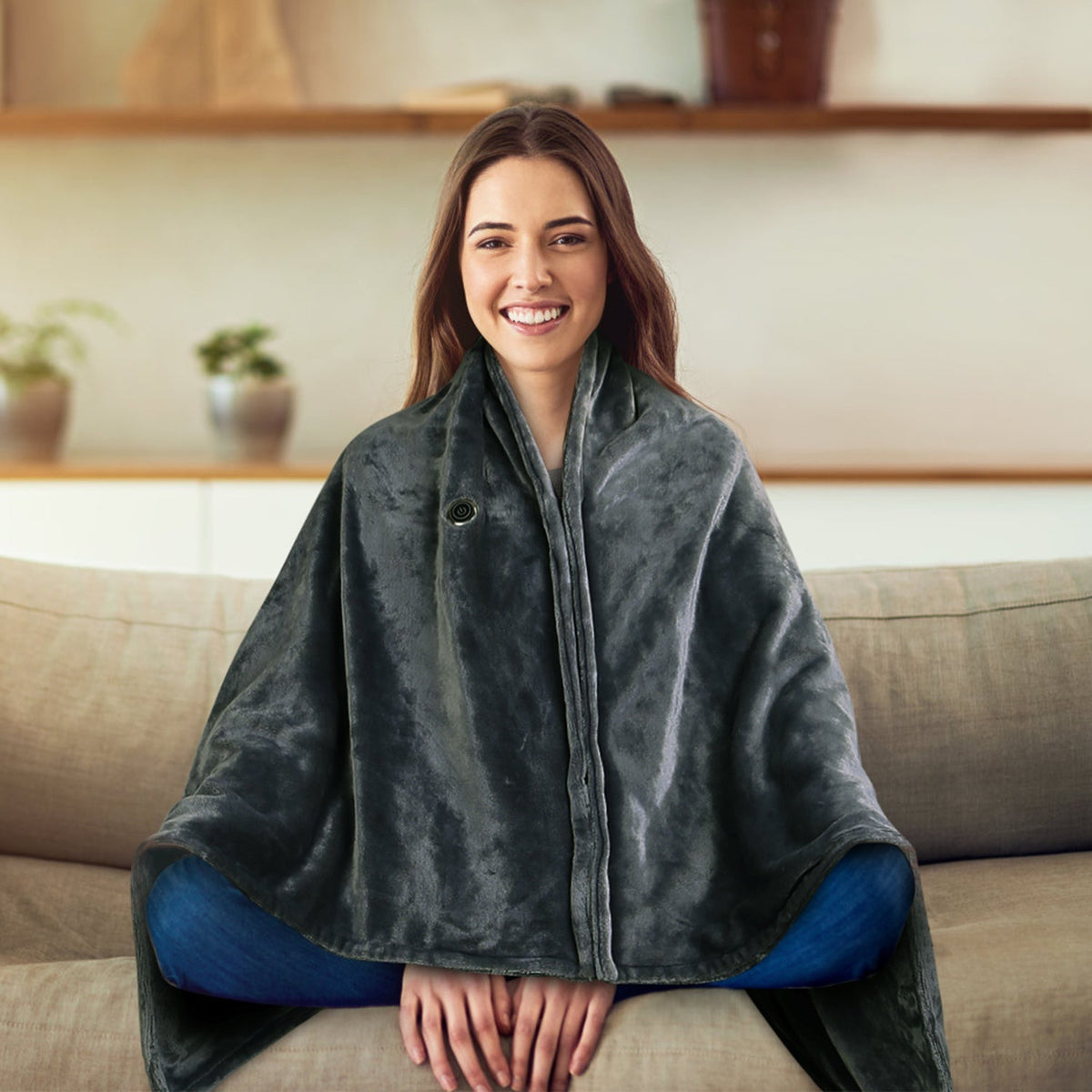 Hooded heated poncho in dark green plush, front zipper closure and loose draped sleeves