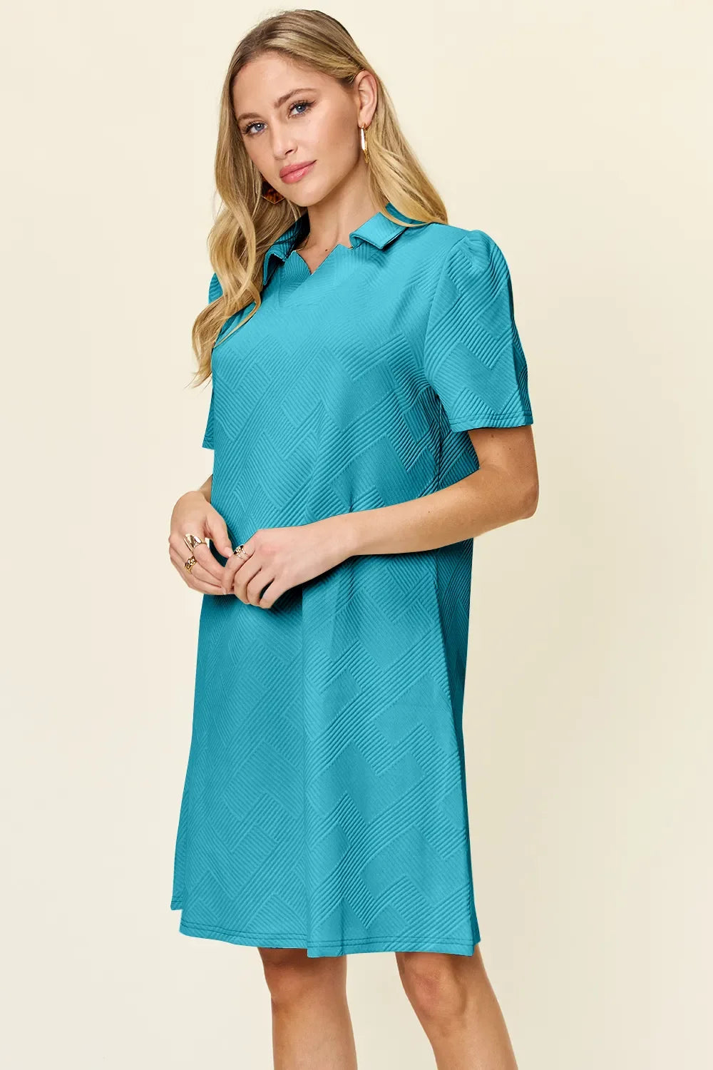 Teal textured collared short-sleeve dress with V neckline, above-knee length.
