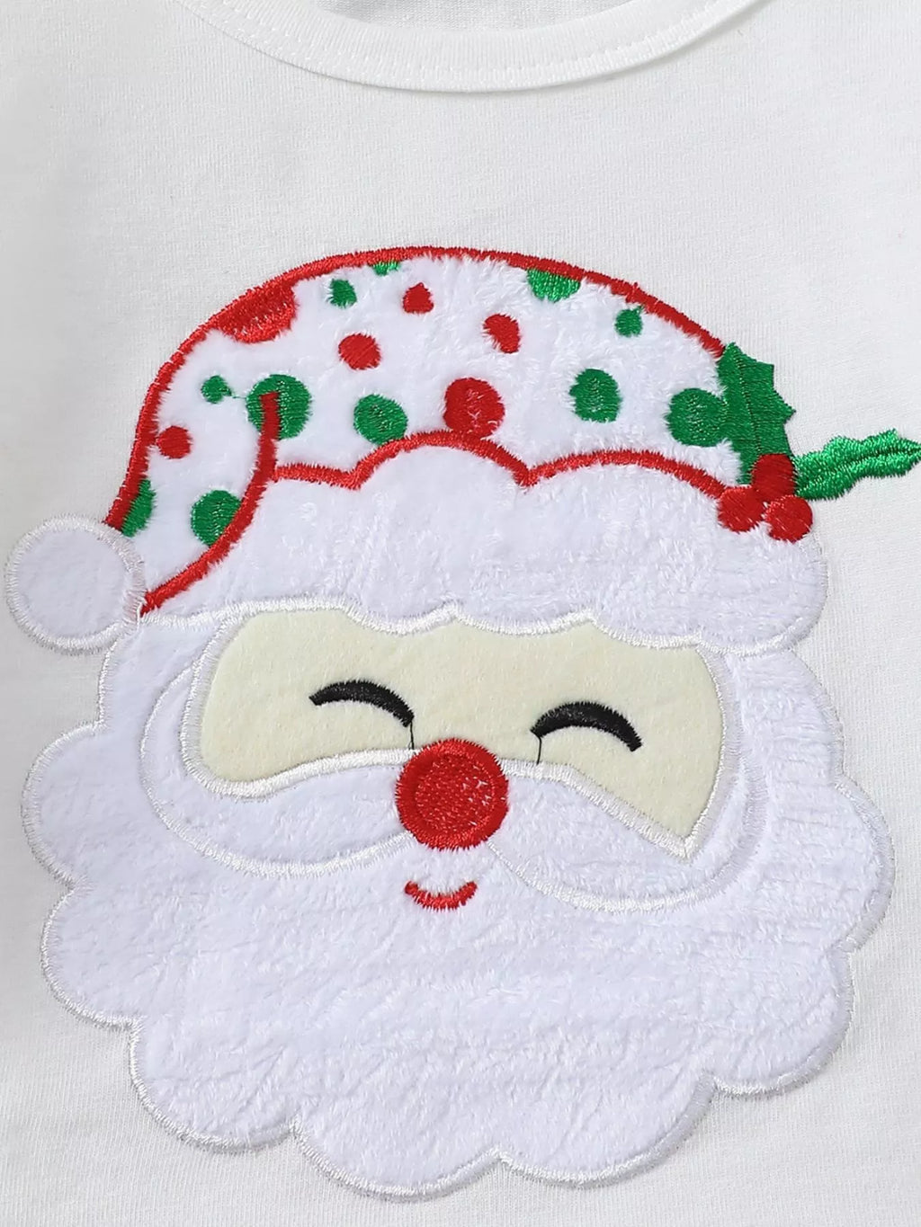 White Christmas top with embroidered Santa face applique
