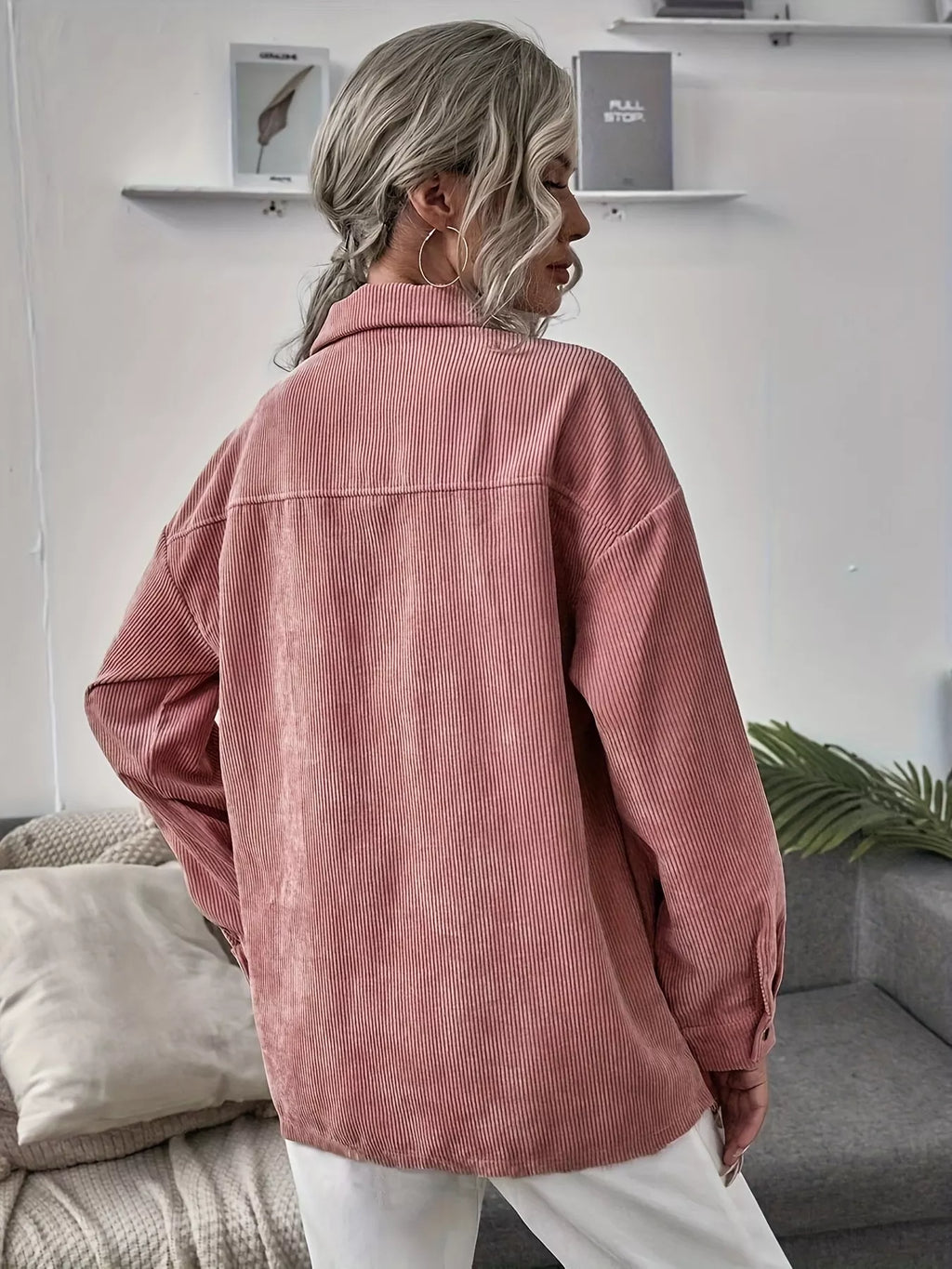 Pink corduroy button-up shacket with long sleeves and button front, back view