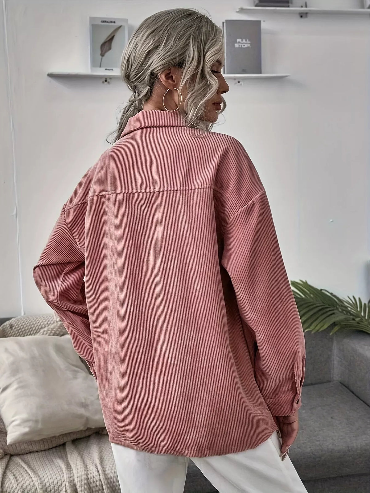 Pink corduroy button-up shacket with long sleeves and button front, back view