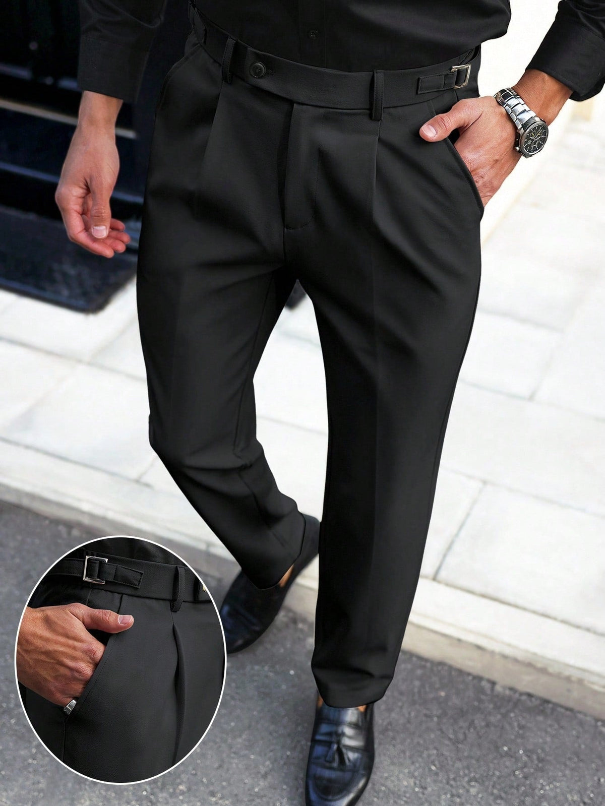 Black straight-leg trousers with belt loops, button fly, and front pleat details
