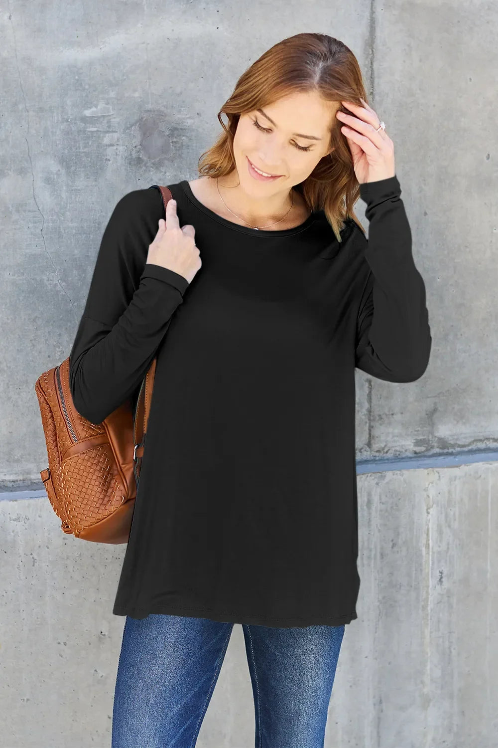 Black relaxed long sleeve crewneck tee with straight neckline and long sleeves