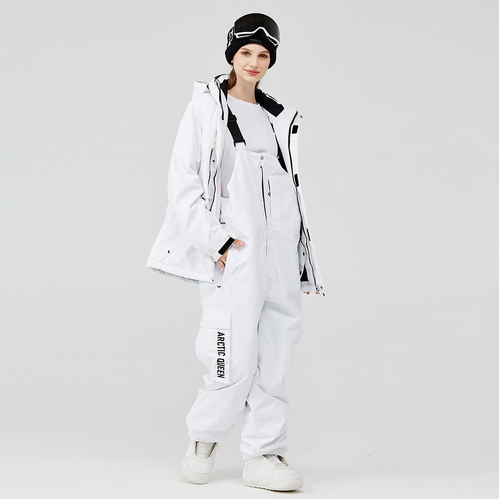 White winter ski suit with hooded jacket and snow pants, black straps and accents
