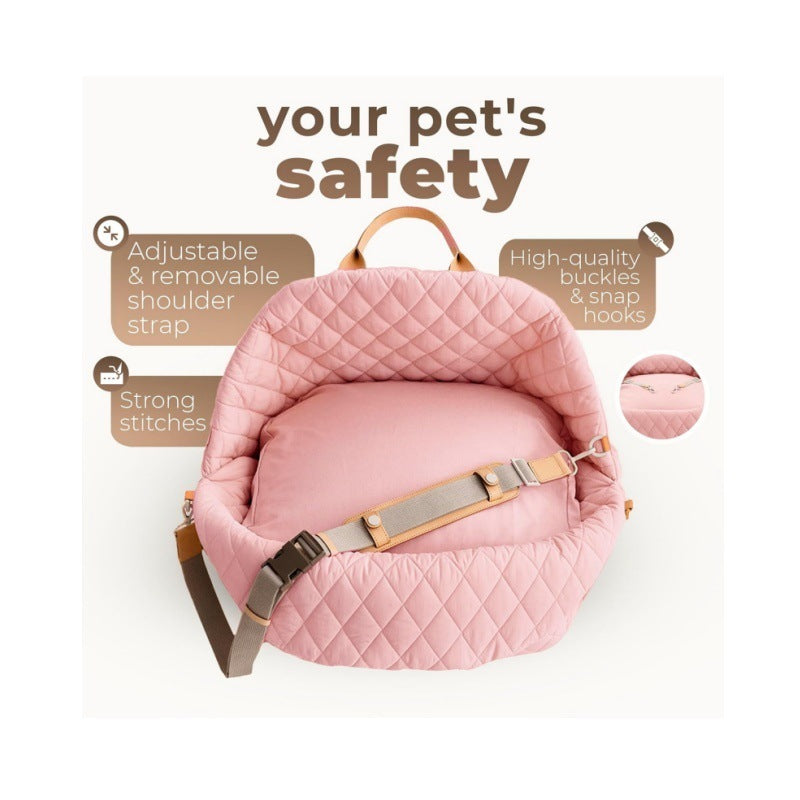 Pink quilted pet carrier with adjustable shoulder strap and safety hooks (diagram)