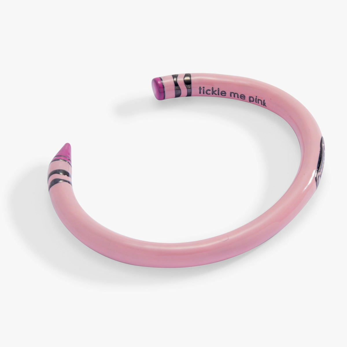 Pink crayon cuff bracelet with “tickle me pink” text and striped top ends
