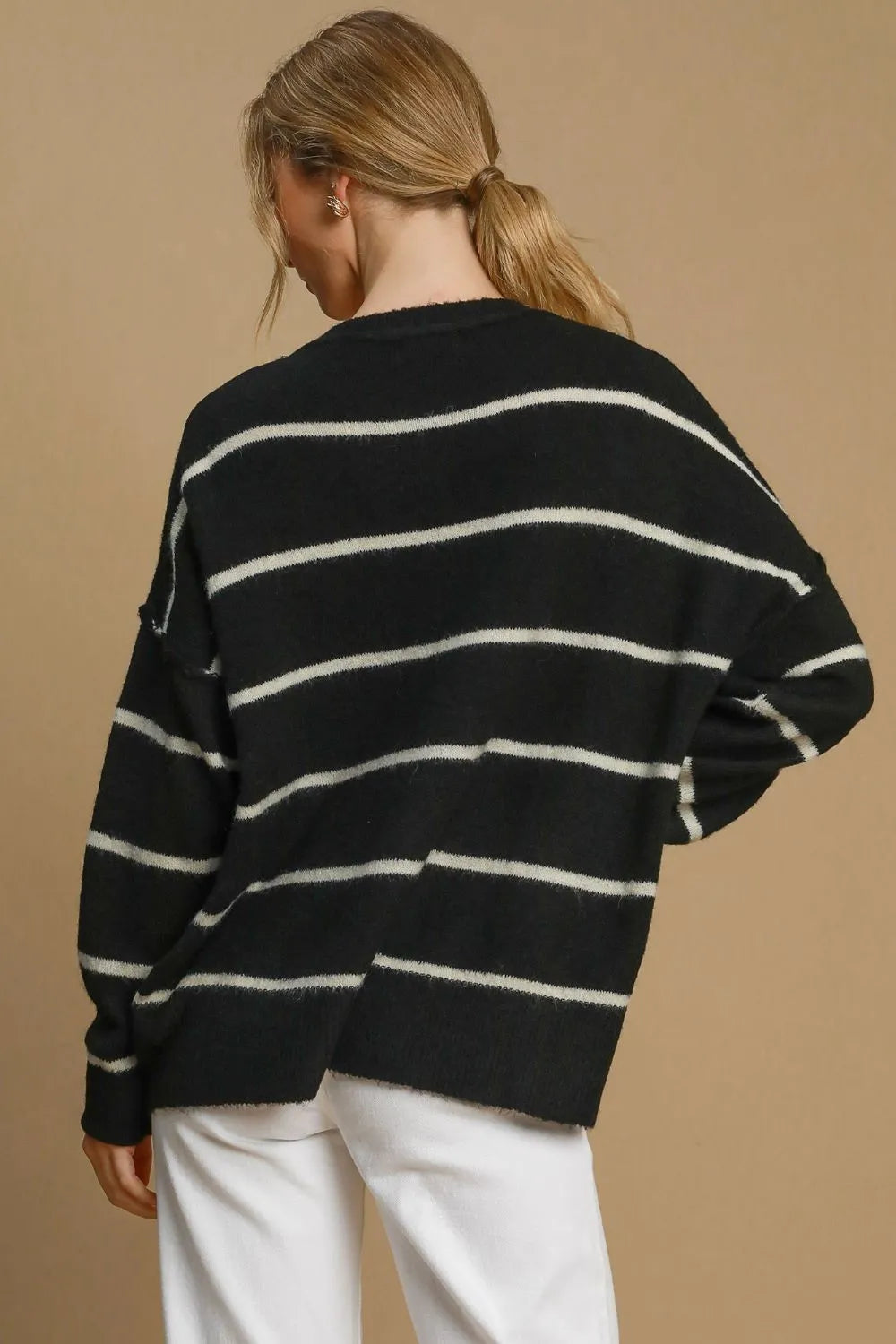 Black and cream striped wool-blend sweater with crew neck and long sleeves, back view