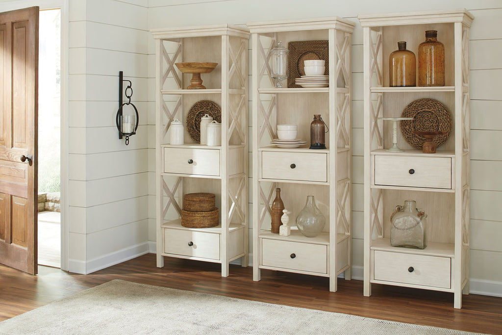 Beige corner display cabinet unit with open shelves and drawers for table set storage.