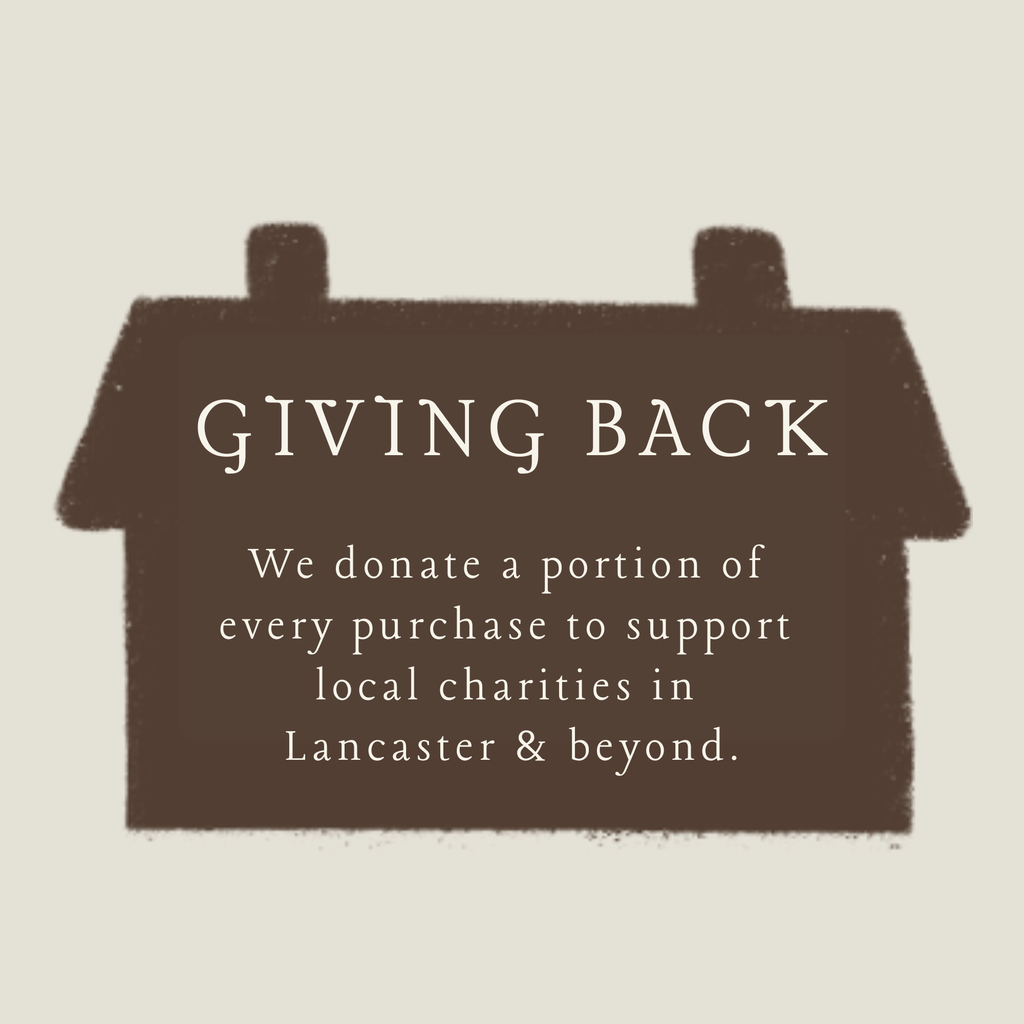 Giving Back wooden promo card with text about donating to local charities