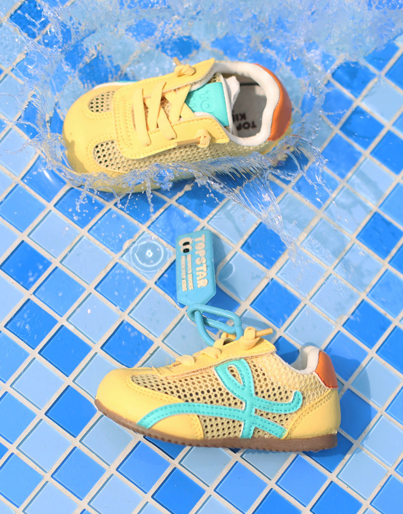 Yellow toddler lace-up sport shoes with teal side stripe and orange heel