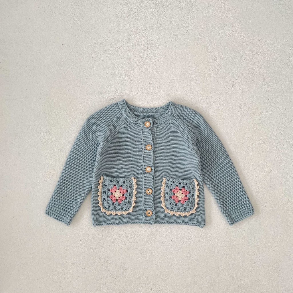 Smokey blue knit cardigan with round collar, button front, crochet flower patch pockets