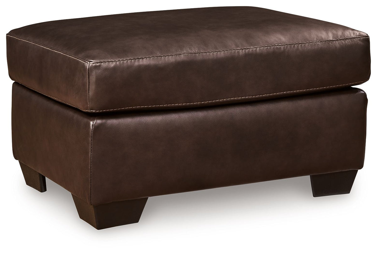 Dark brown padded leather-look ottoman with square tapered legs and stitched top seam